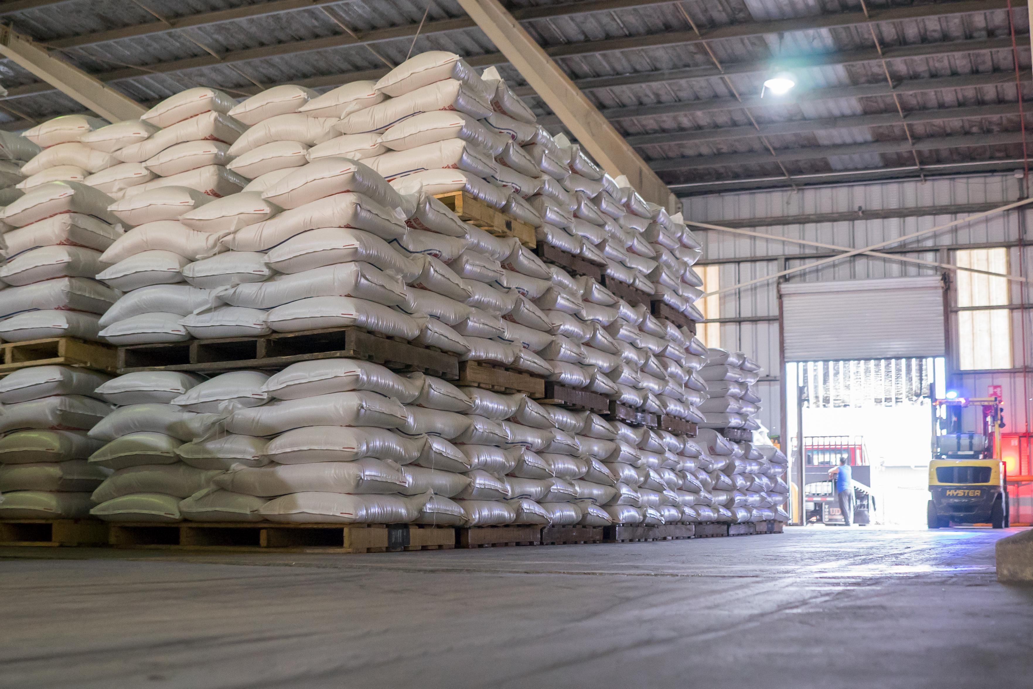 Packaged feed additives stored on pallets in a warehouse